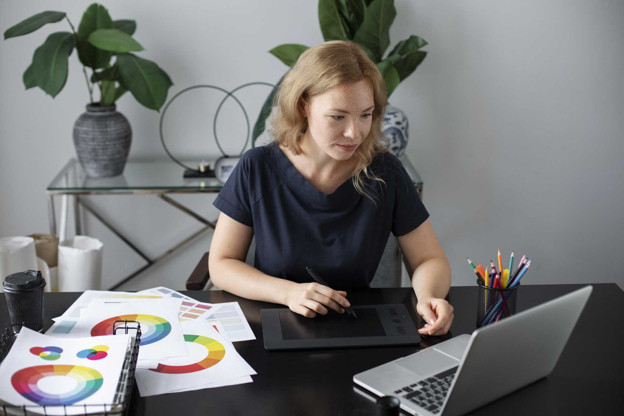 female-logo-designer-working-her-office-graphic-tablet